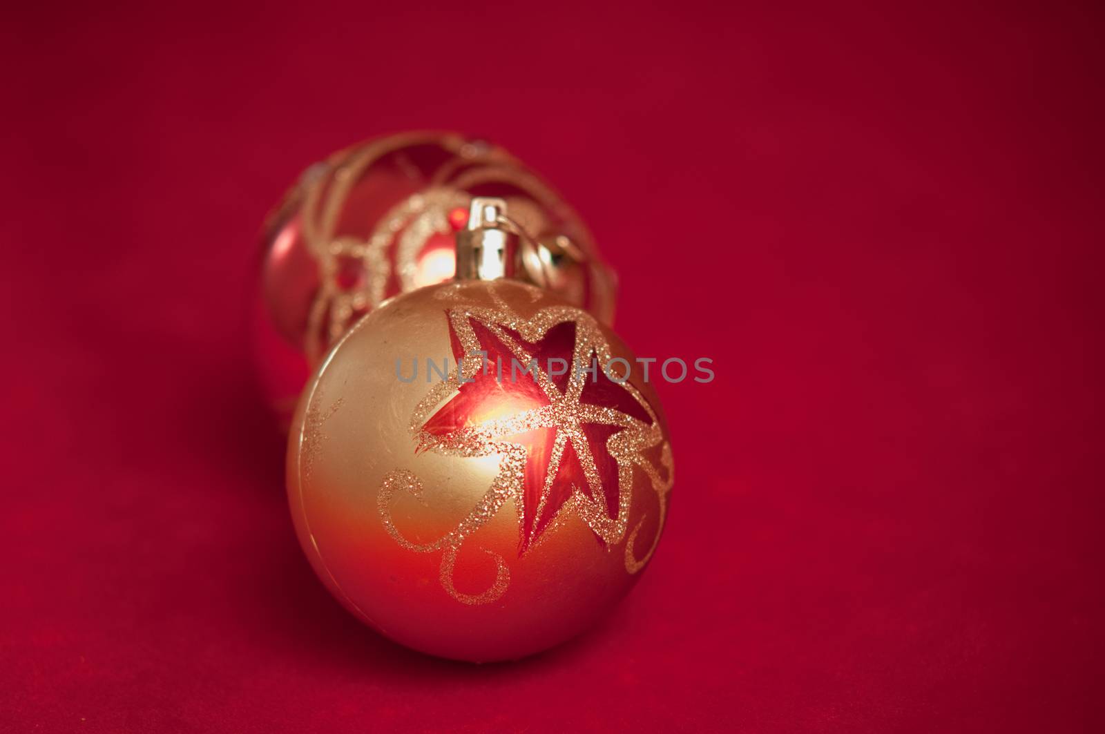 Varicoloured christmas balls on red  background  .