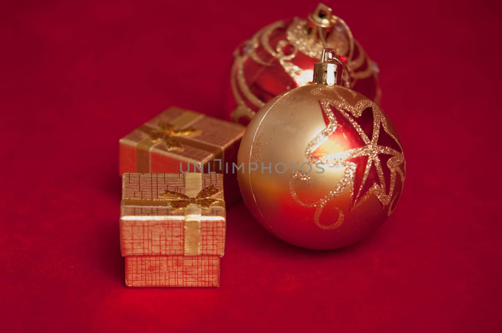 Varicoloured christmas balls on red  background  .