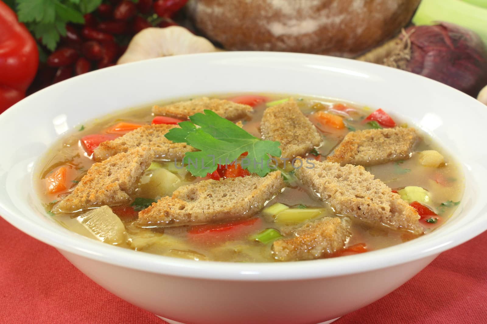 a plate with a colorful bread soup