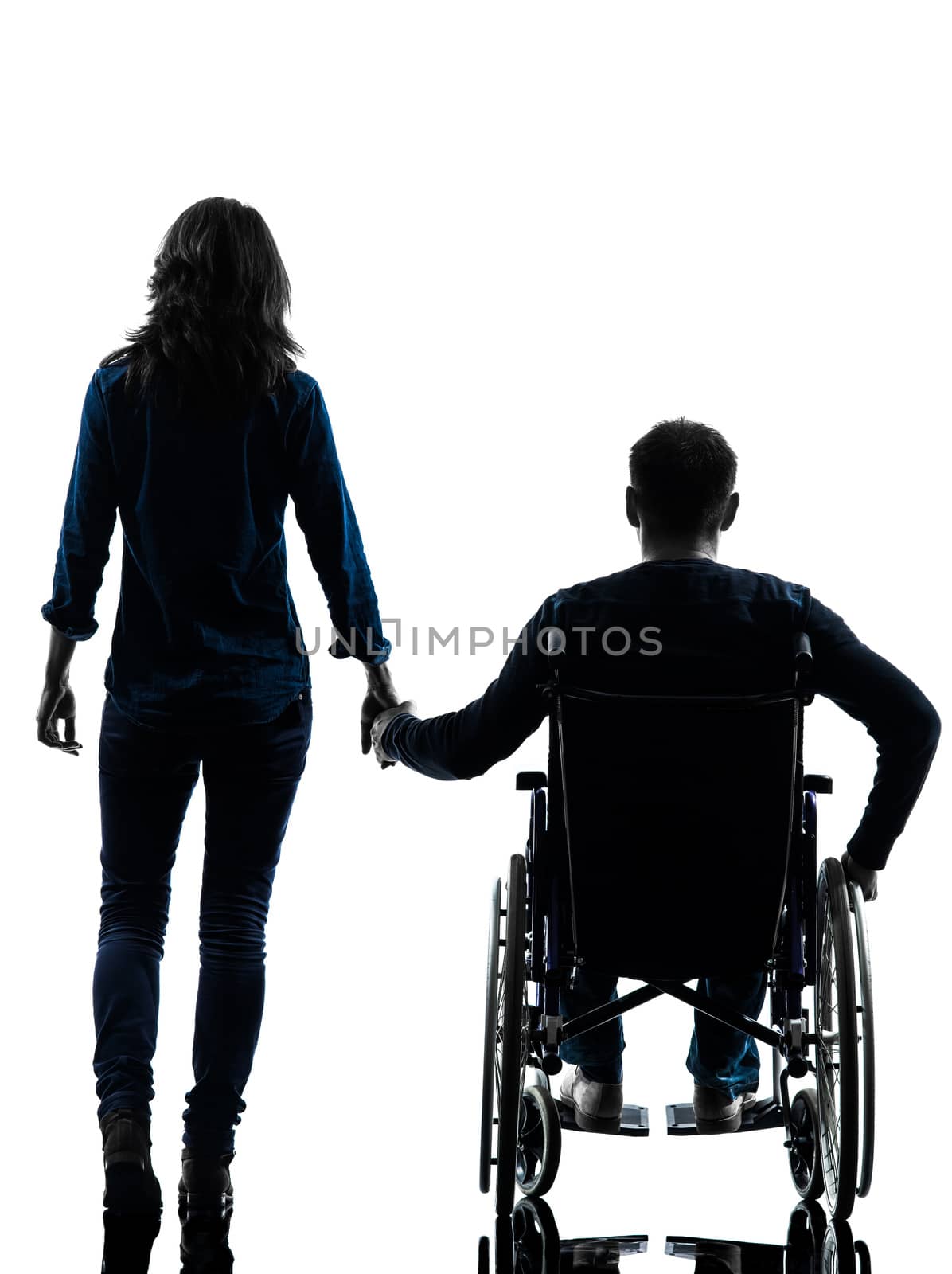 handicapped man in wheelchair  and woman holding hands silhouett by PIXSTILL