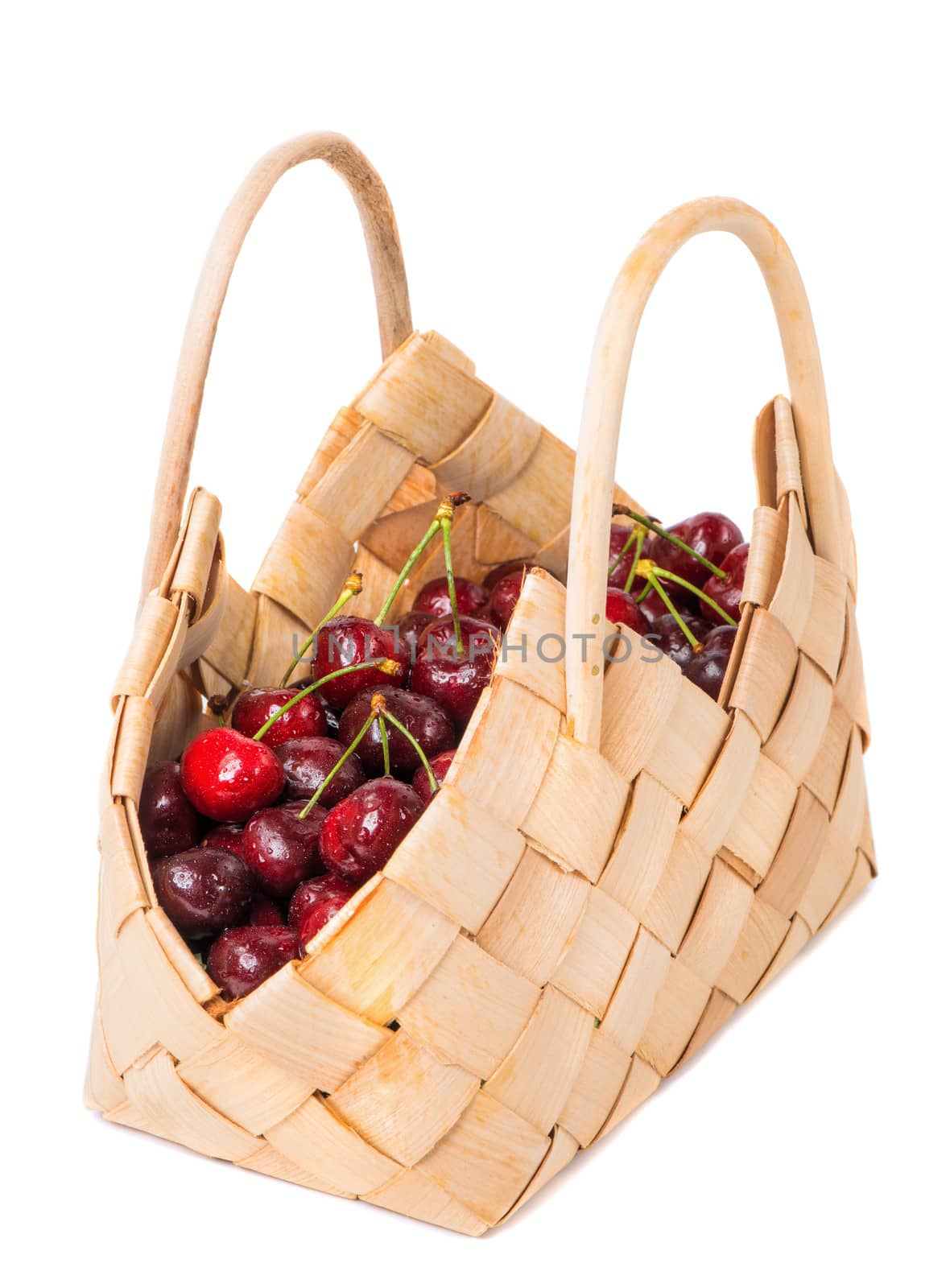 Sweet cherry in basket isolated on white background