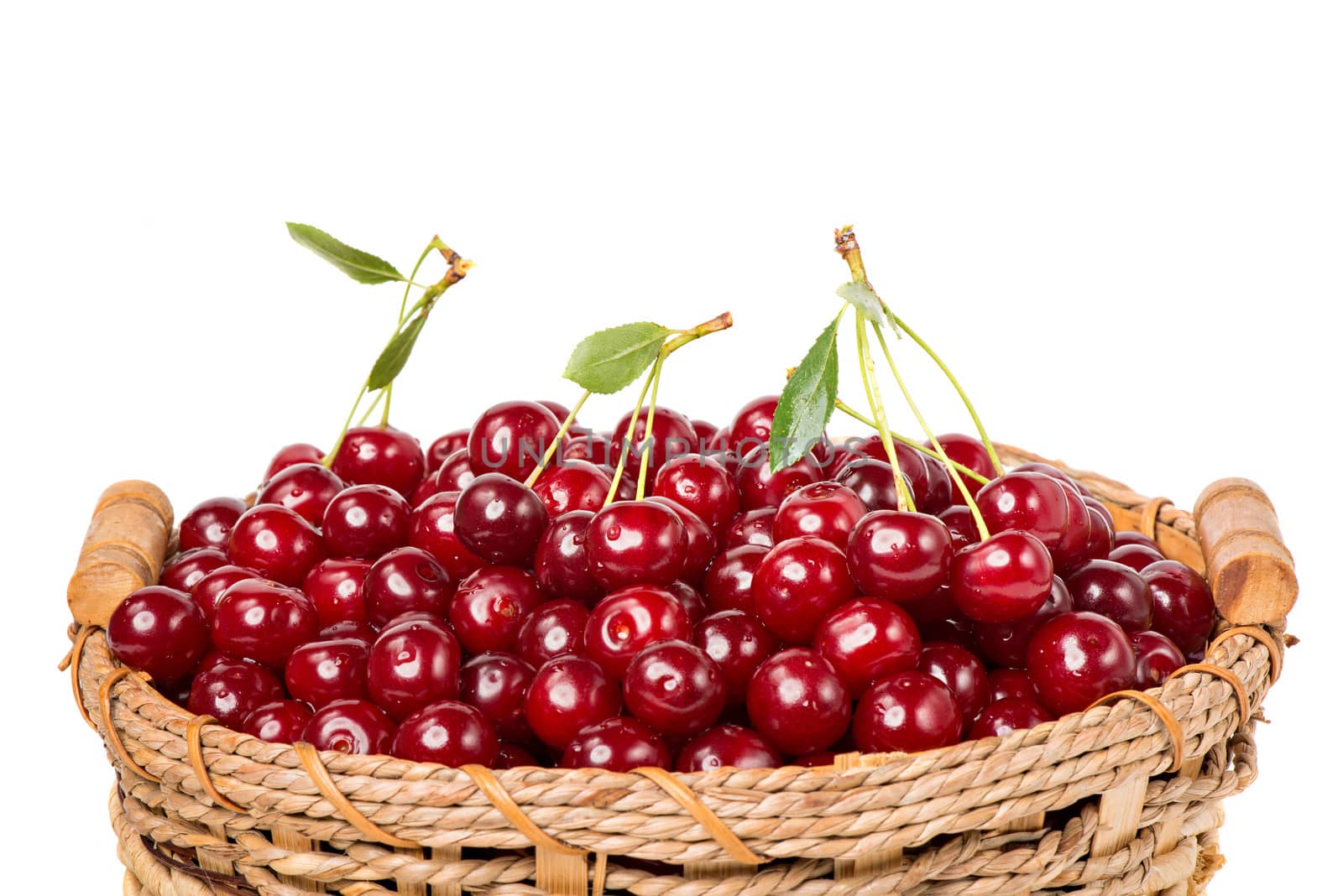 Sweet cherry in basket isolated on white background