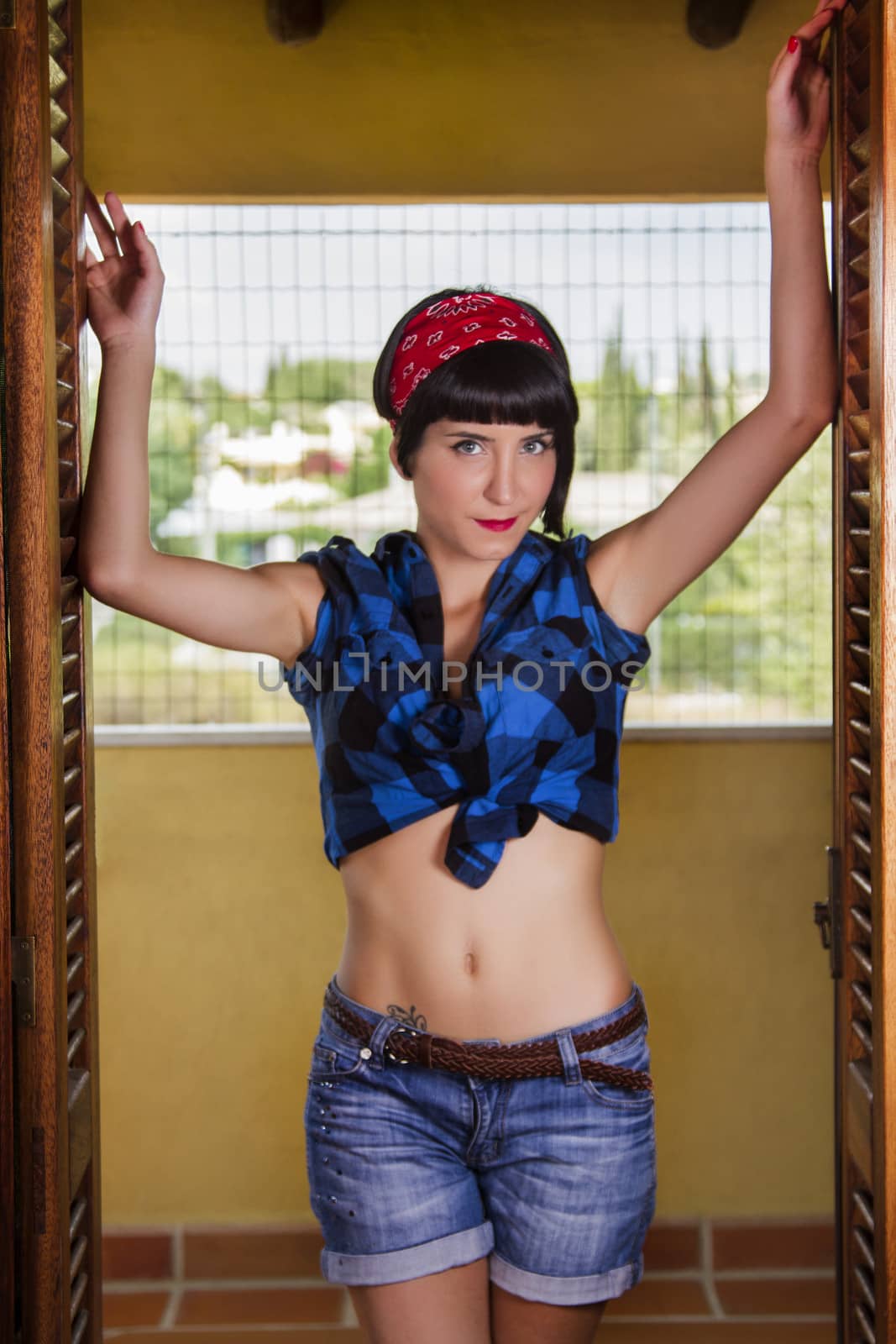 View of a pin-up girl happy with short hair.