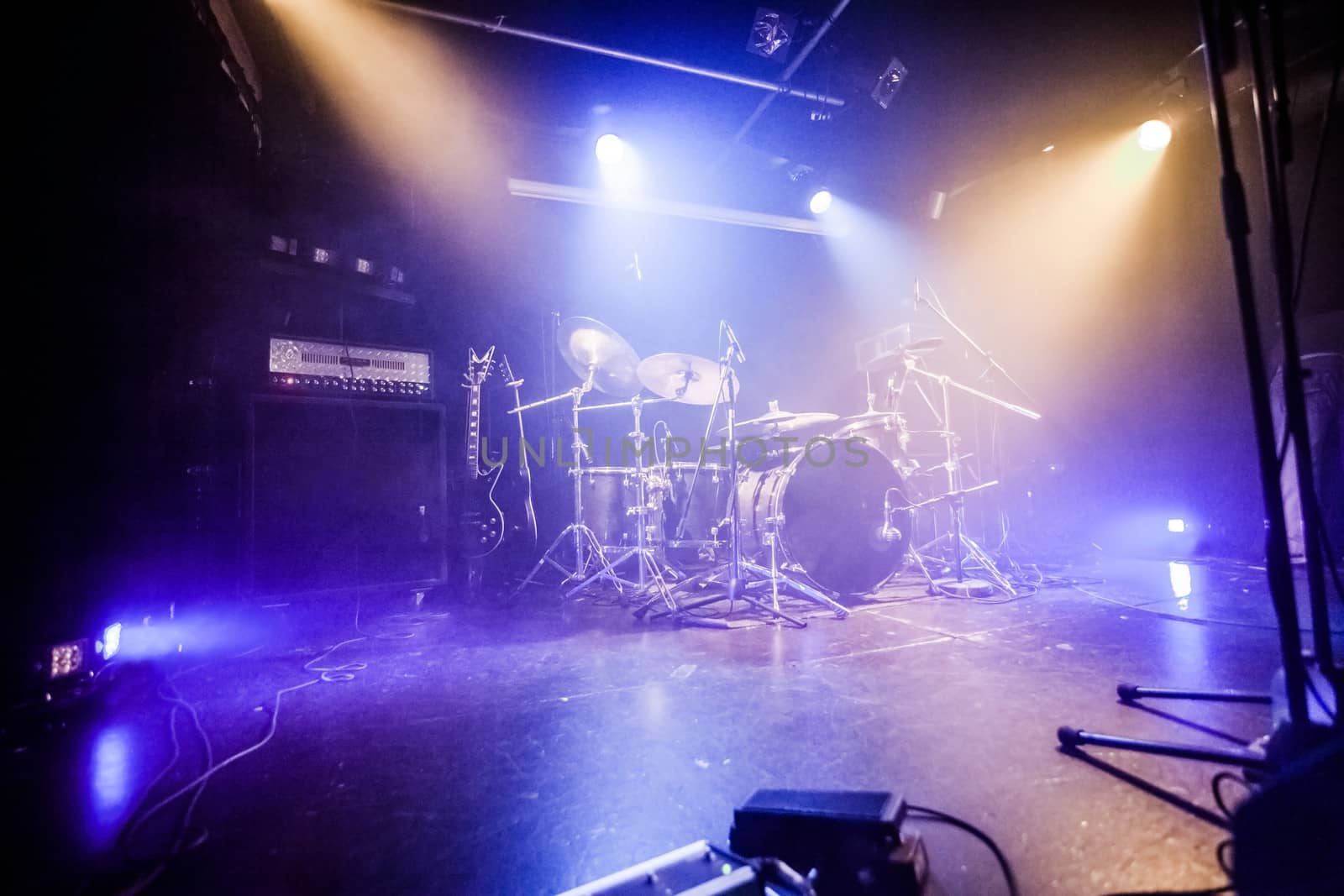 Drumkit on empty stage waiting for musicians (logo removed)