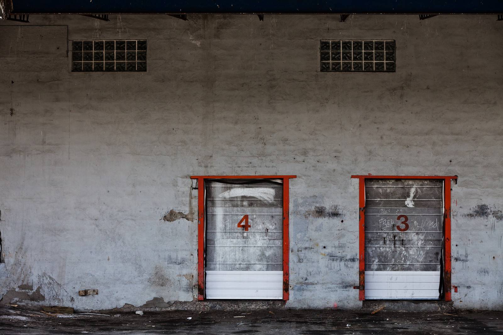 Old Grungy Industrial Garage Door with Graffitis. by aetb