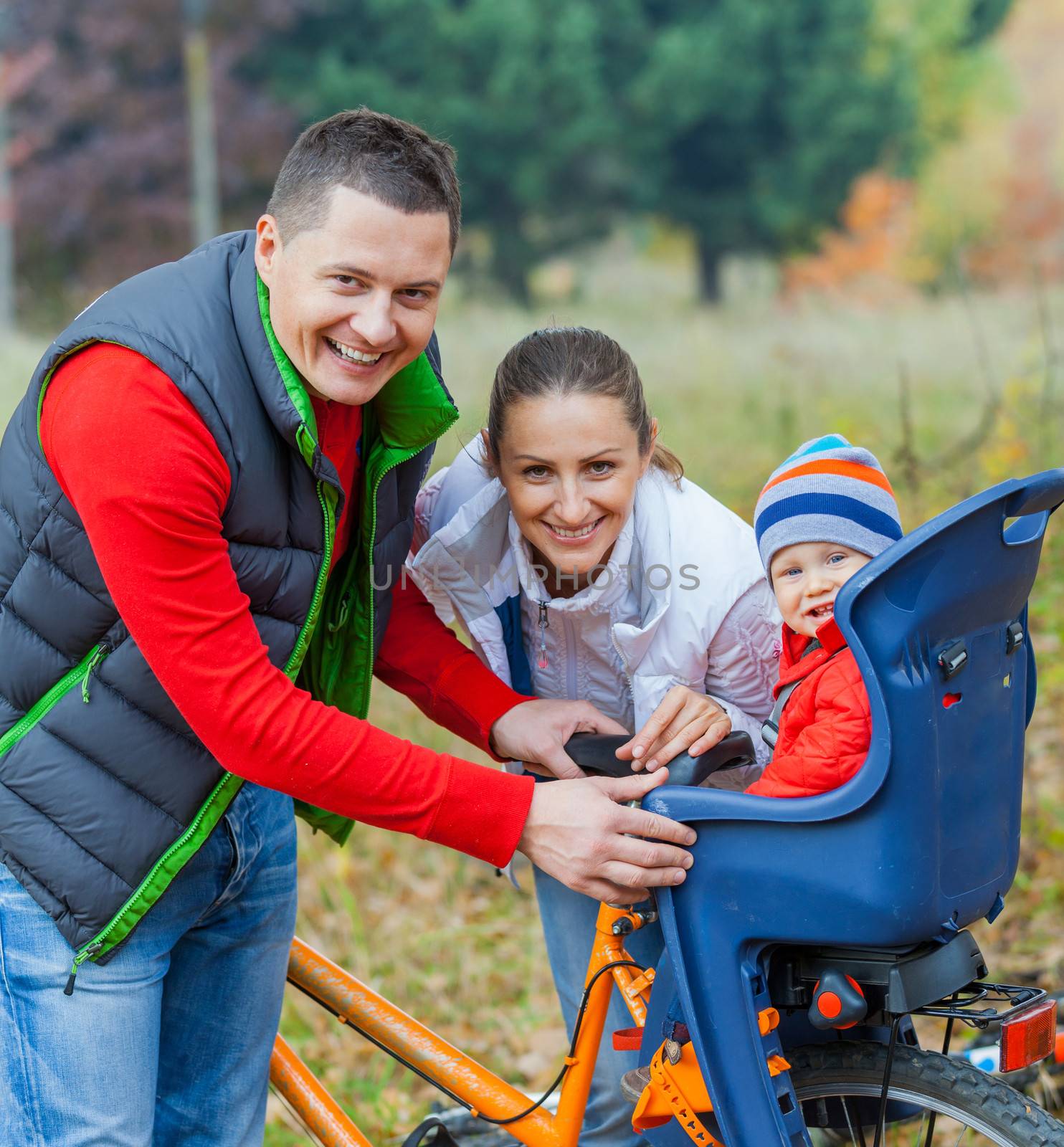 Family with baby on bikes. by maxoliki