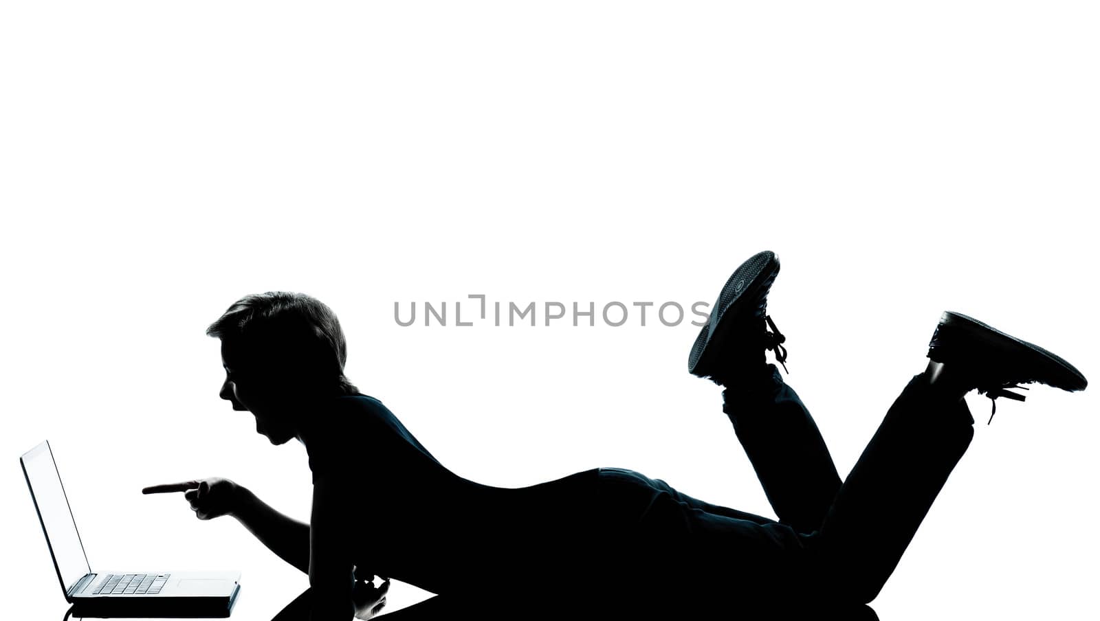 one caucasian young teenager silhouette boy girl computer computing laptop lying on front full length in studio cut out isolated on white background