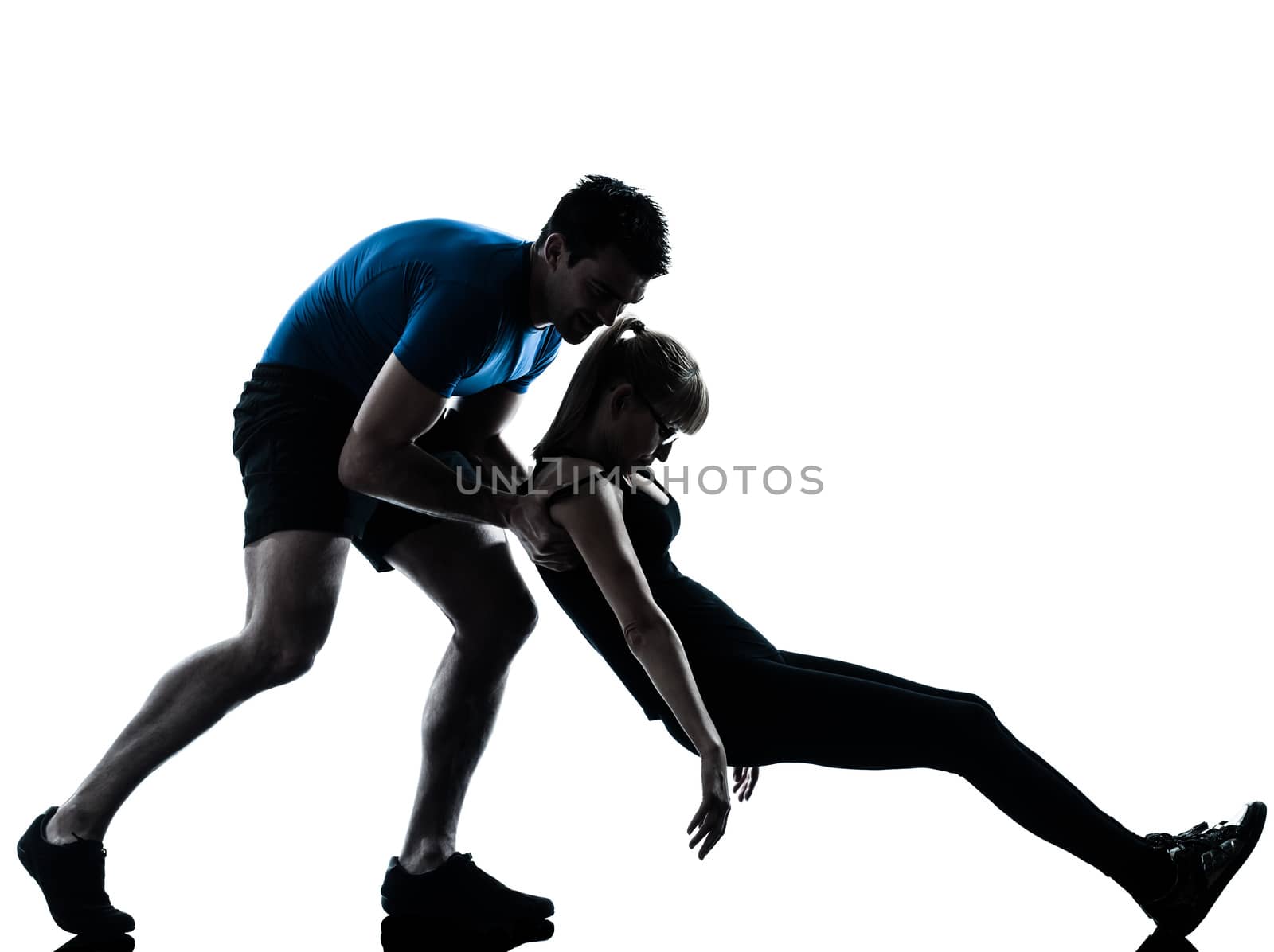 caucasian aerobics instructor  with mature woman exercising fitness workout in silhouette studio isolated on white background