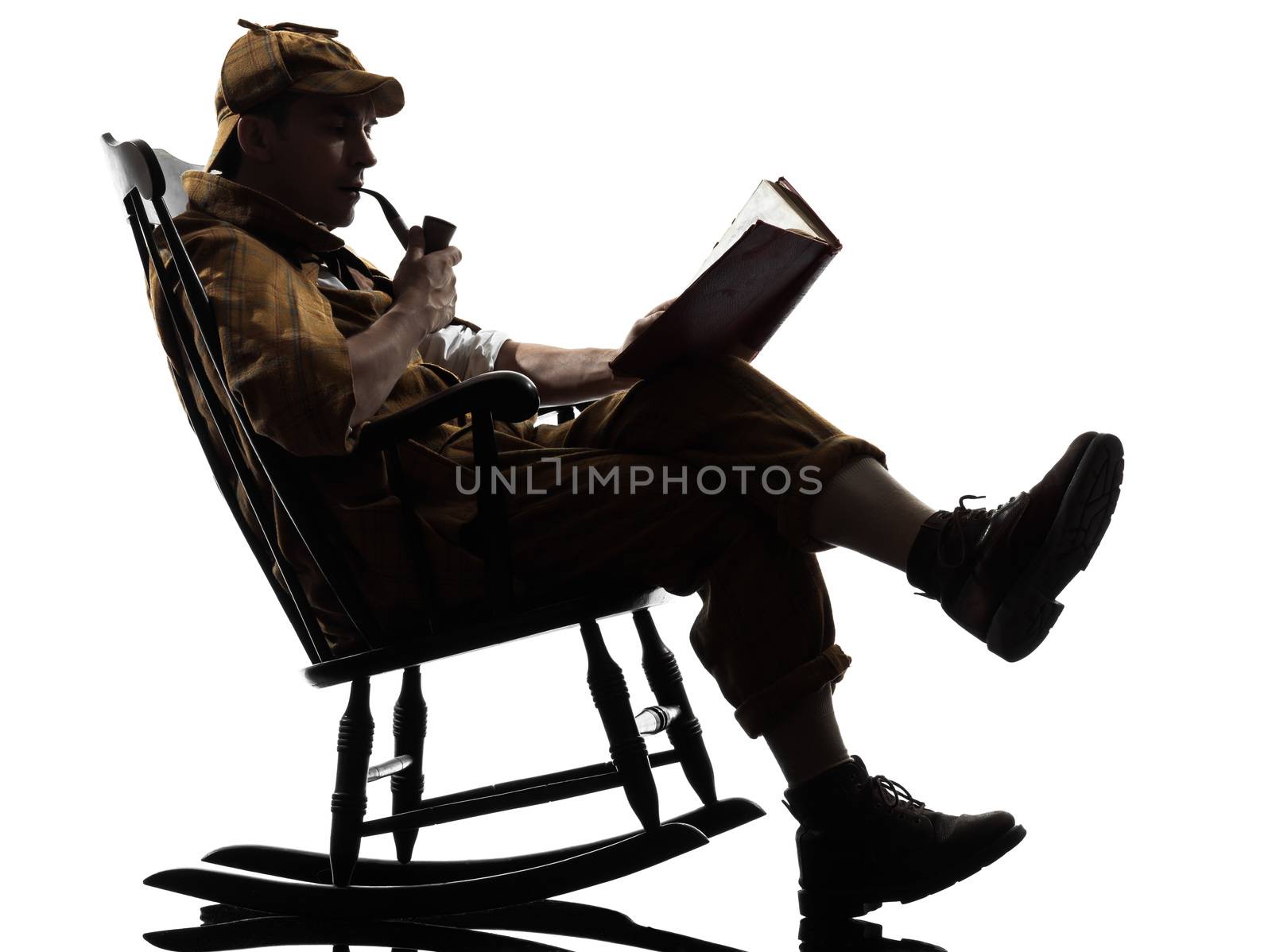 sherlock holmes reading silhouette sitting in rocking chair in studio on white background