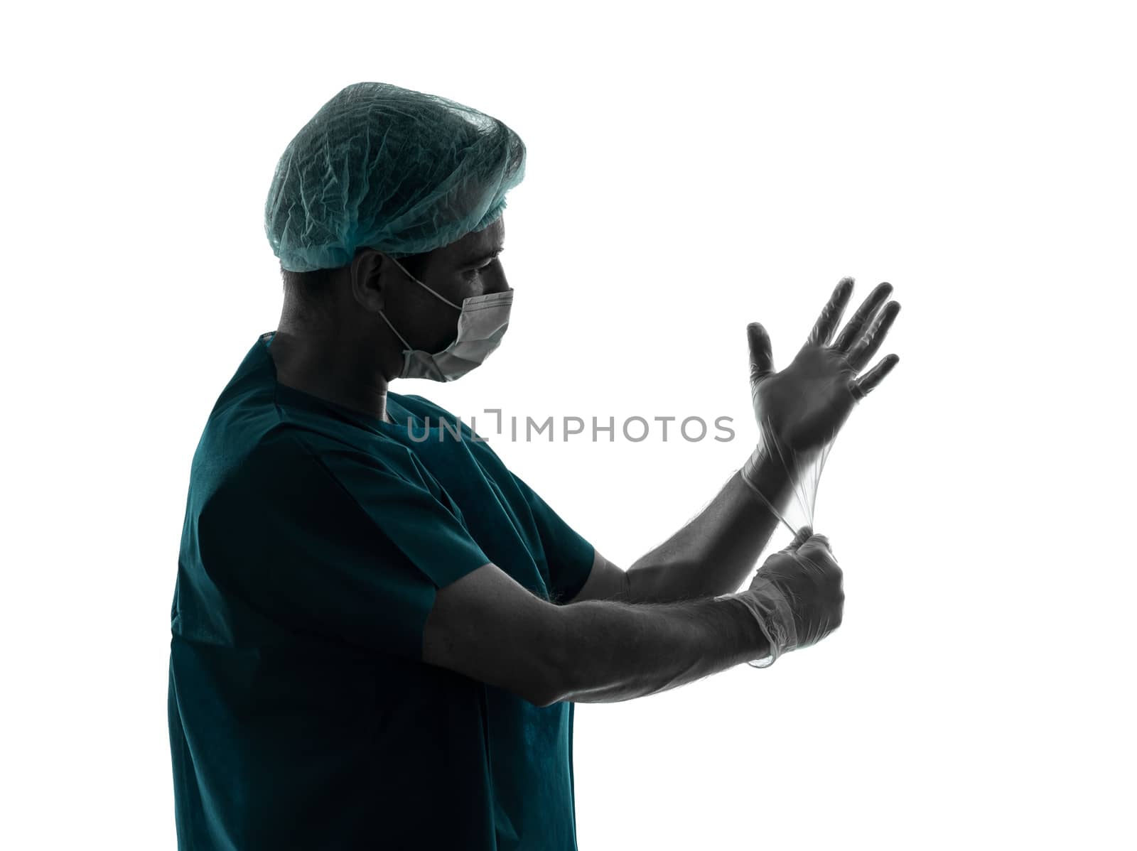 one caucasian doctor surgeon man  latex gloves portrait with face mask medical worker silhouette isolated on white background