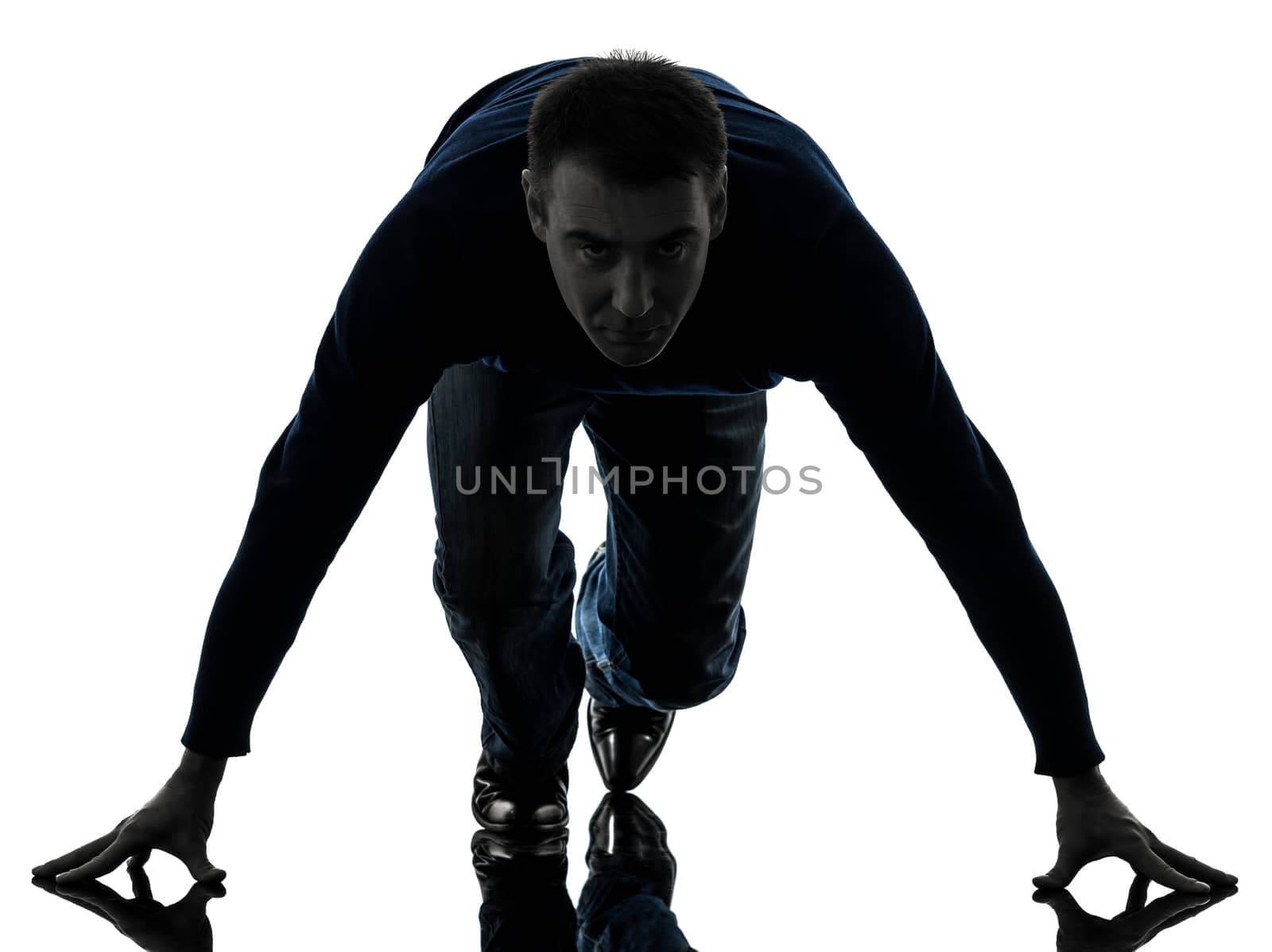 one caucasian man starting blocks full length in silhouette studio isolated on white background