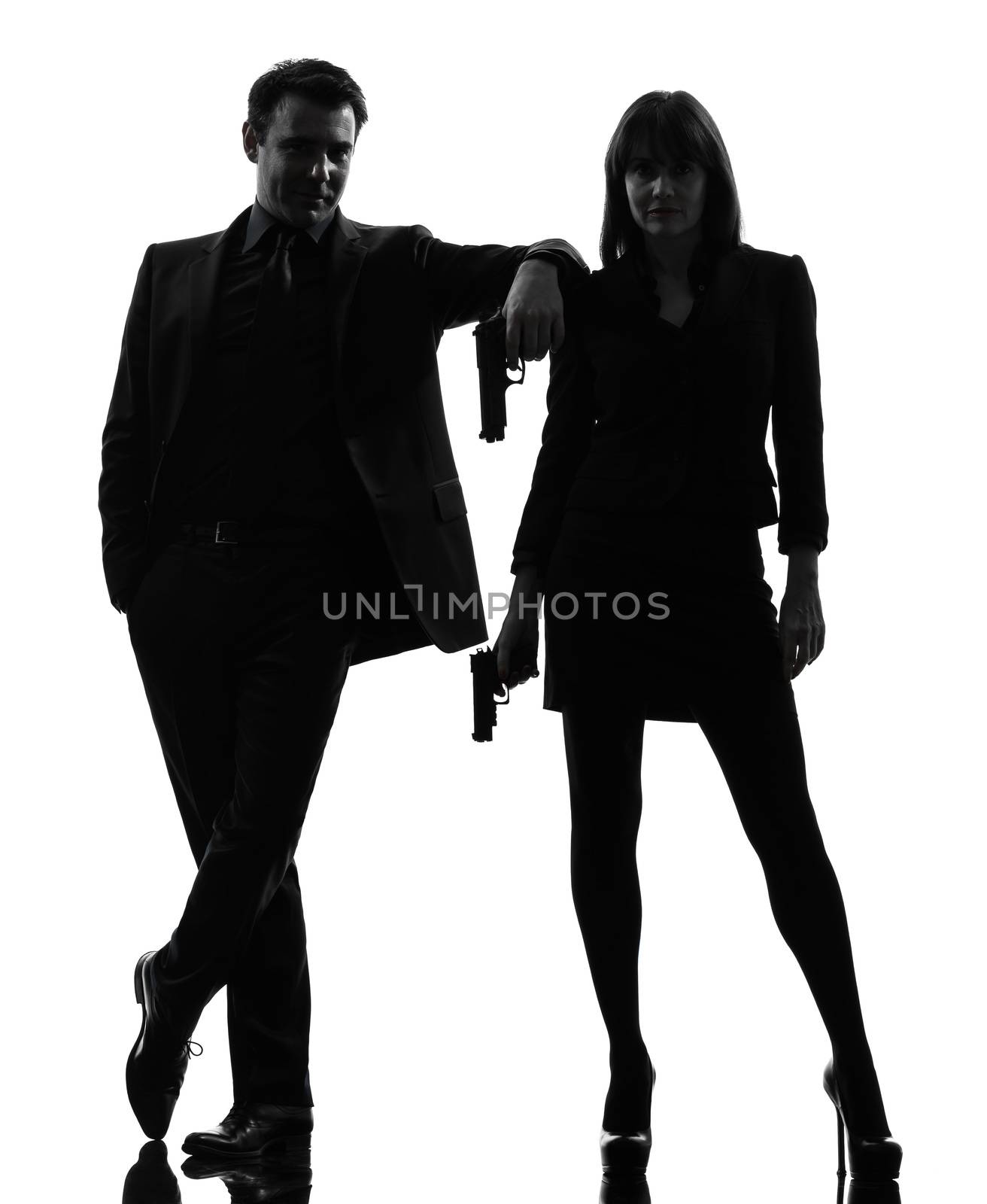 one caucasian man detective secret agent criminal  with gun  in silhouette studio isolated on white background