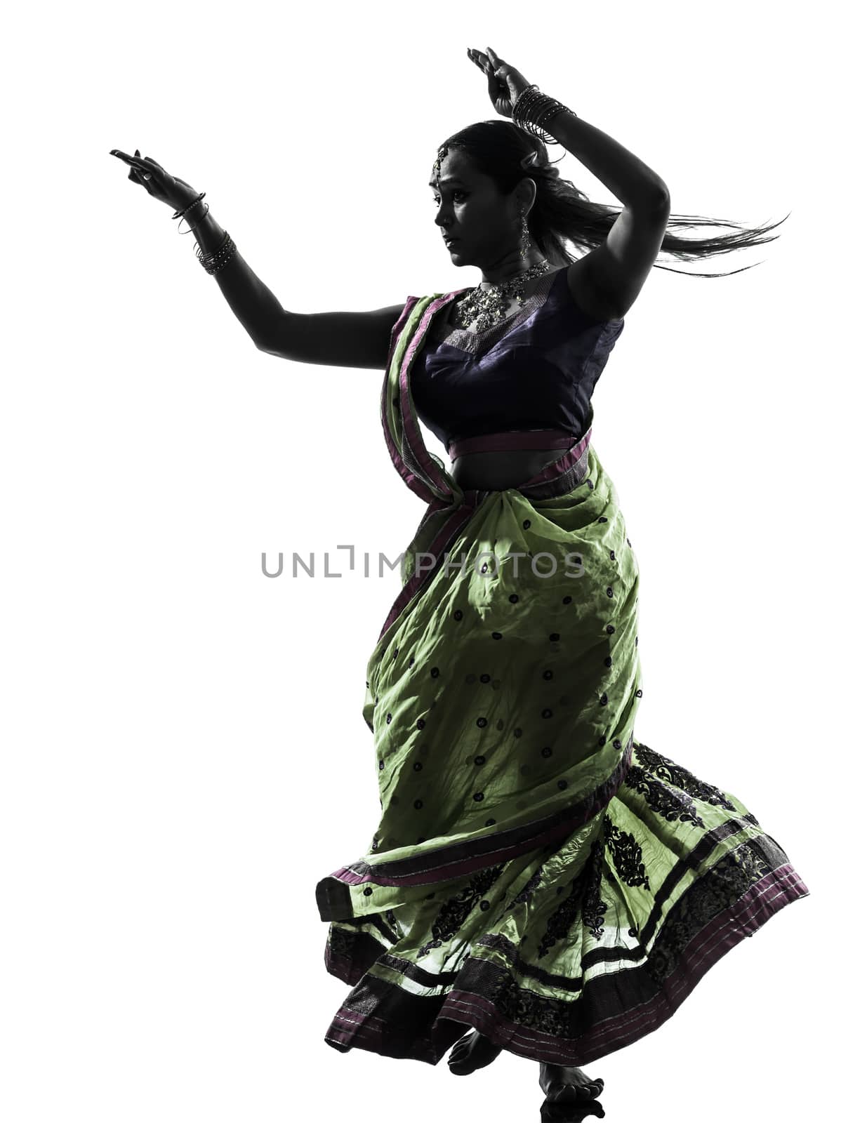 one indian woman dancer dancing in silhouette studio isolated on white background