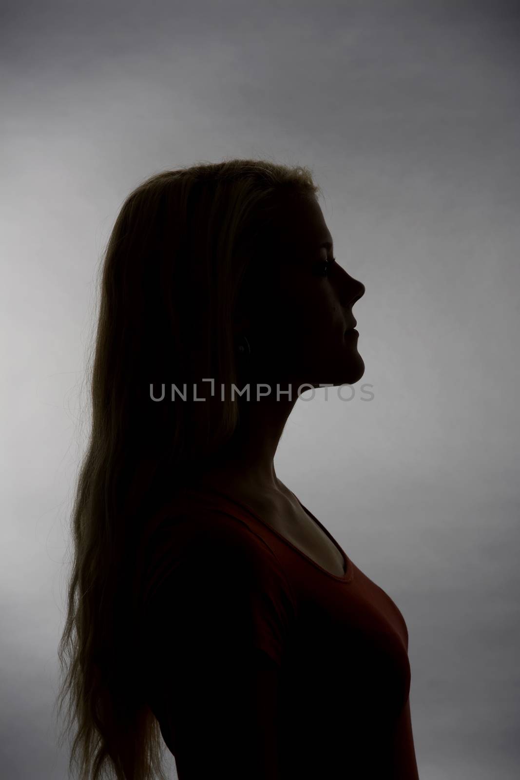 Silhouette of a young blond woman