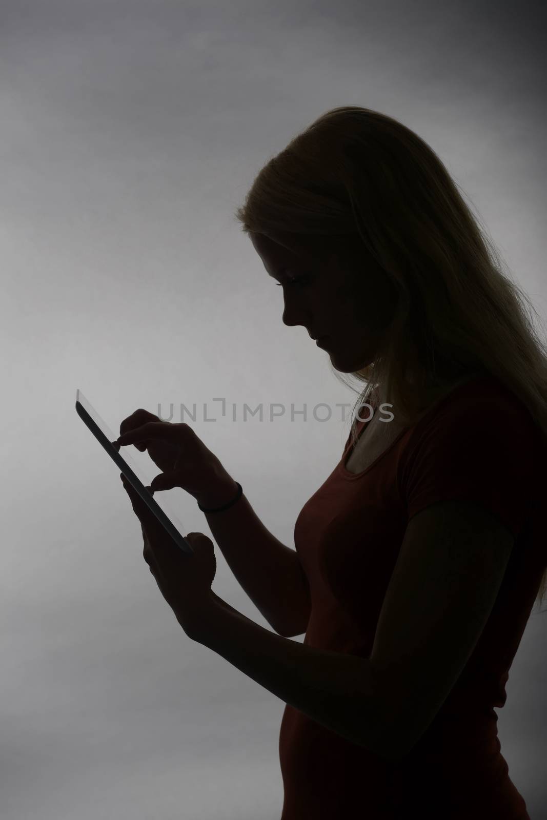young blond woman with tablet pc