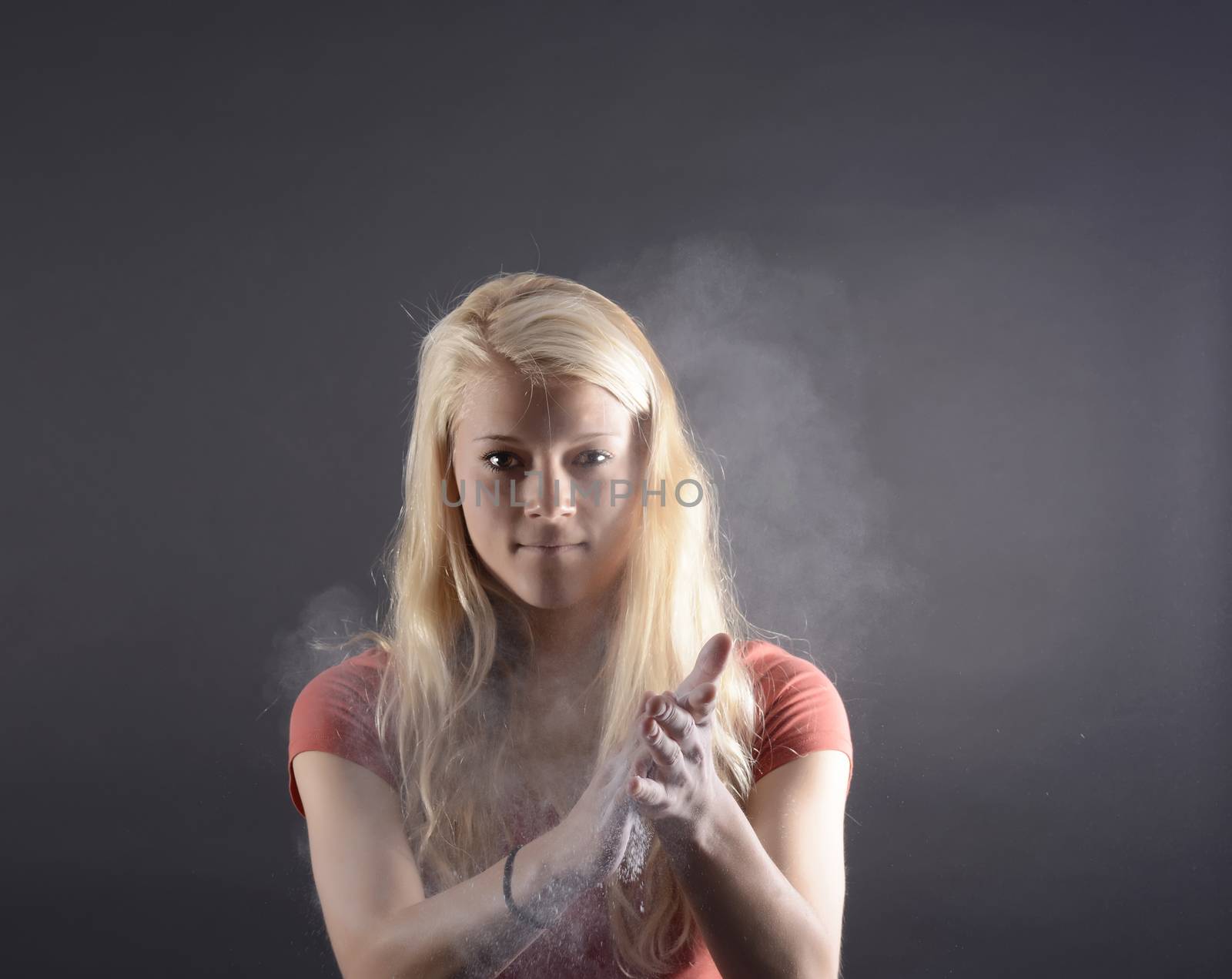beautiful young blond woman applauding