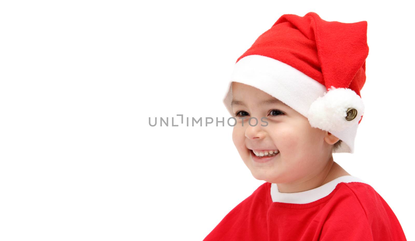 happy child in santa claus hat by NikolayK