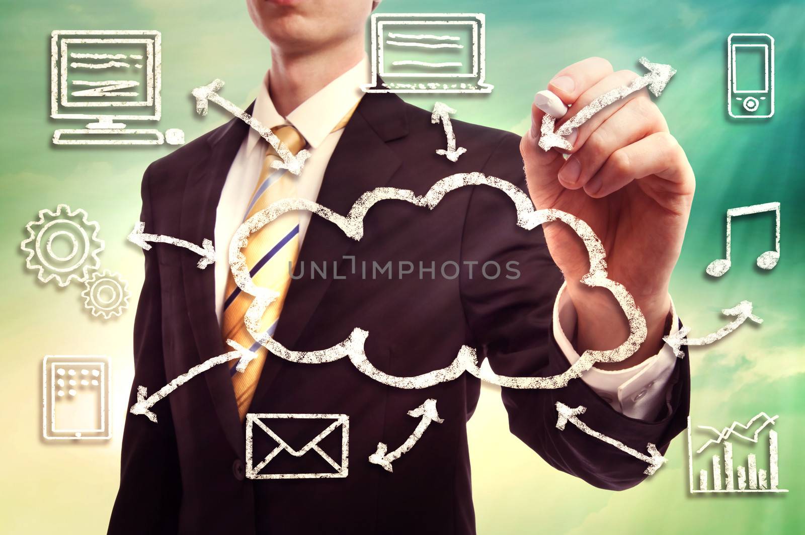 Businessman drawing cloud computing concept with white chalk