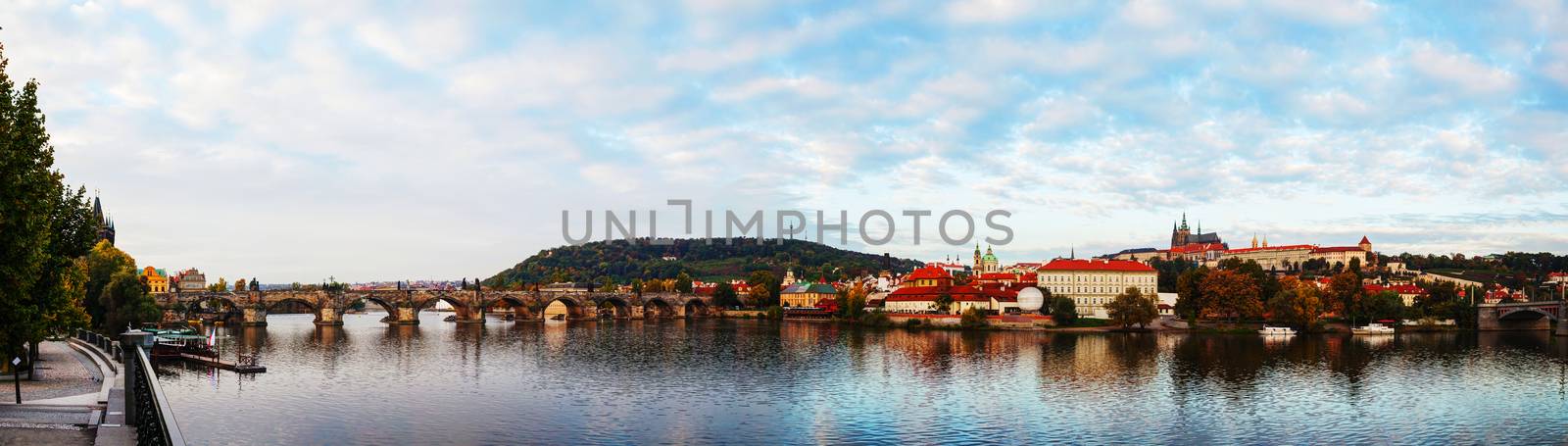 Panoramic overview of old Prague with Charles bridge by AndreyKr