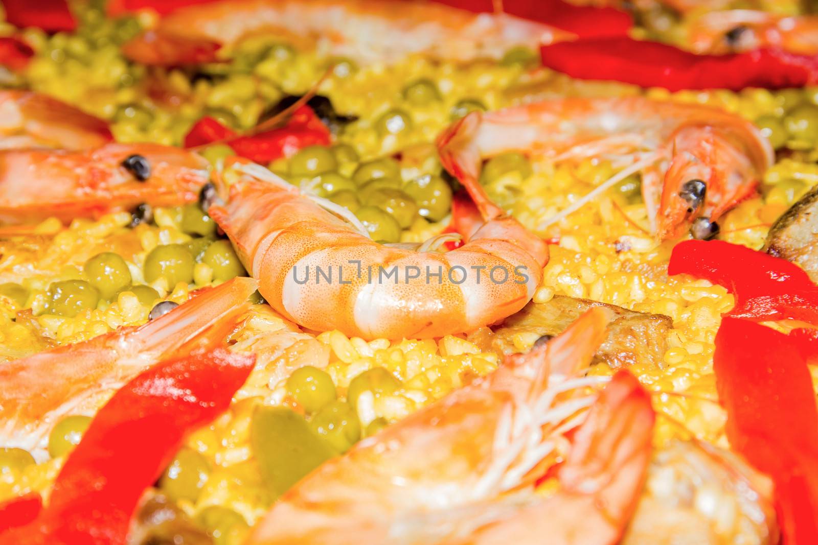 Closeup of prawn in a traditional spanish paella with yellow rice