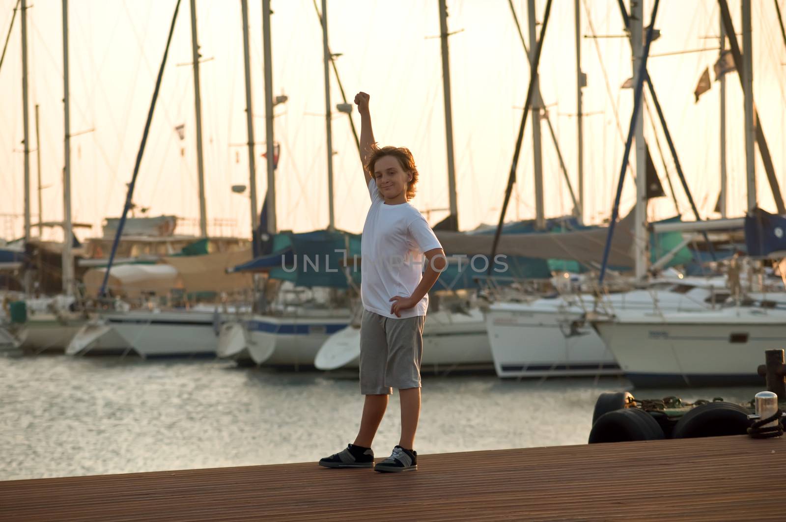 Portrait of a boy on the docks at the yacht club in Tel Aviv.