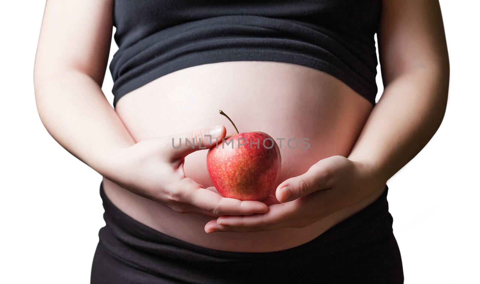 Pregnant woman holding a red apple in her hands by doble.d
