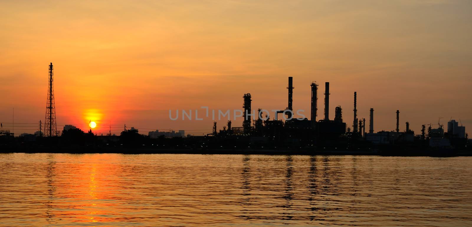 Sunrise scene of Oil refinery by pixbox77