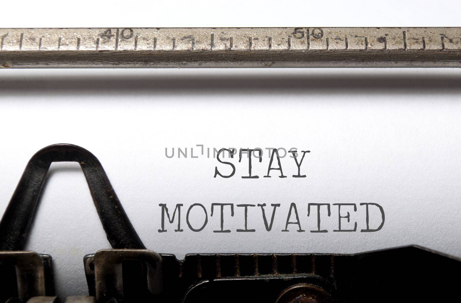 Stay motivated heading printed on a typewriter 