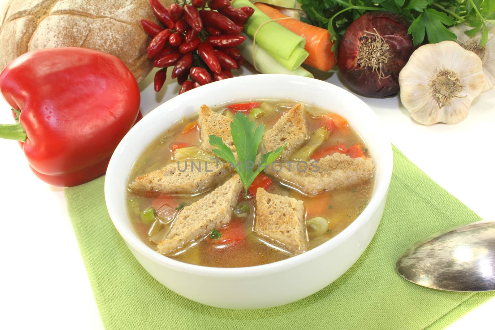 Bread soup with croutons on a light background