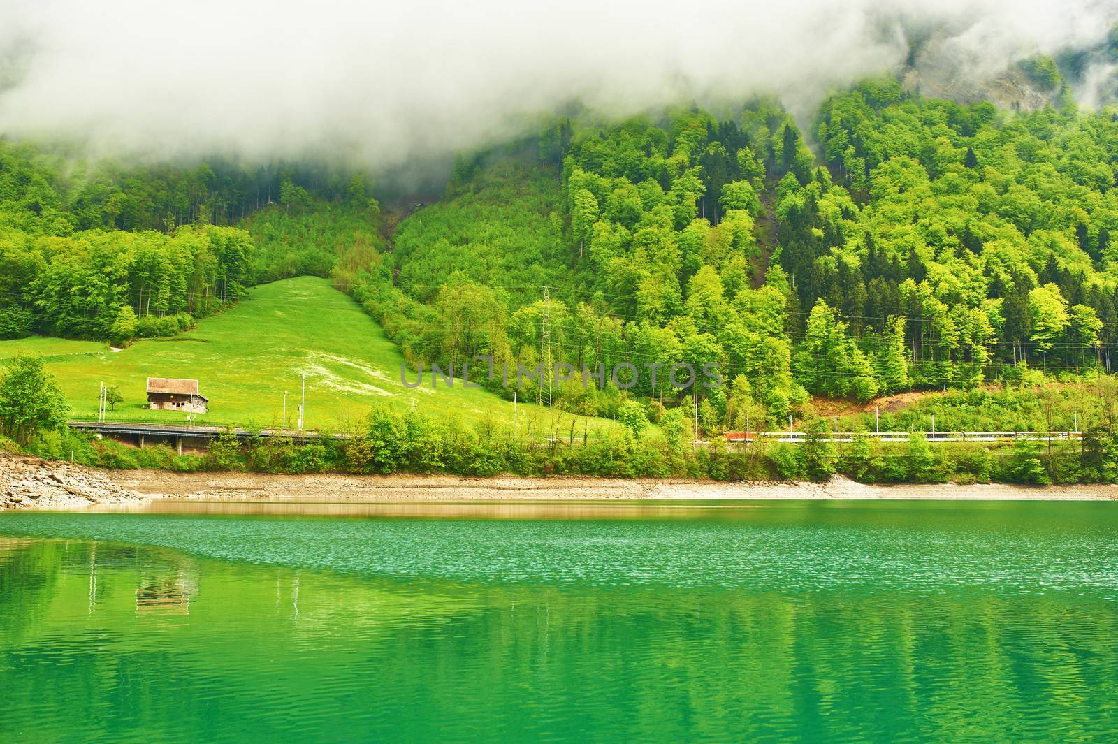 Beautiful emerald mountain lake in Switzerland  by haveseen