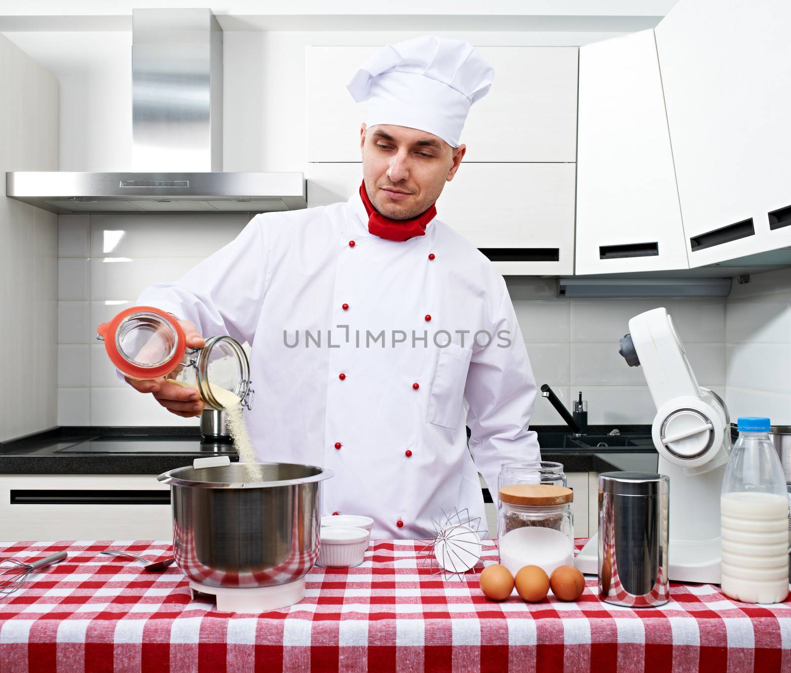 Male chef at kitchen getting ready to cook