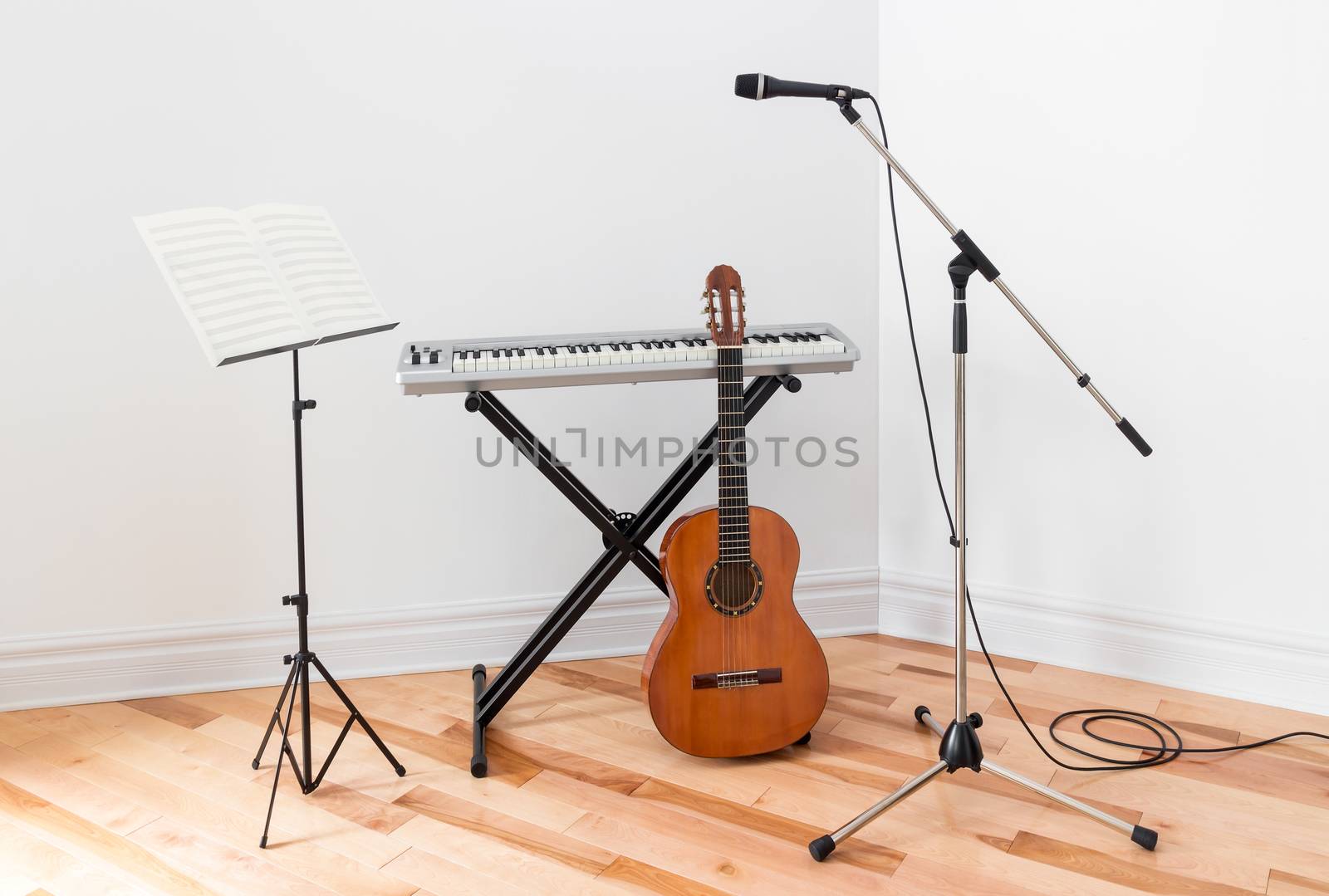 Musical instruments in a room. Electric piano, guitar, microphone and stand with sheet music.
