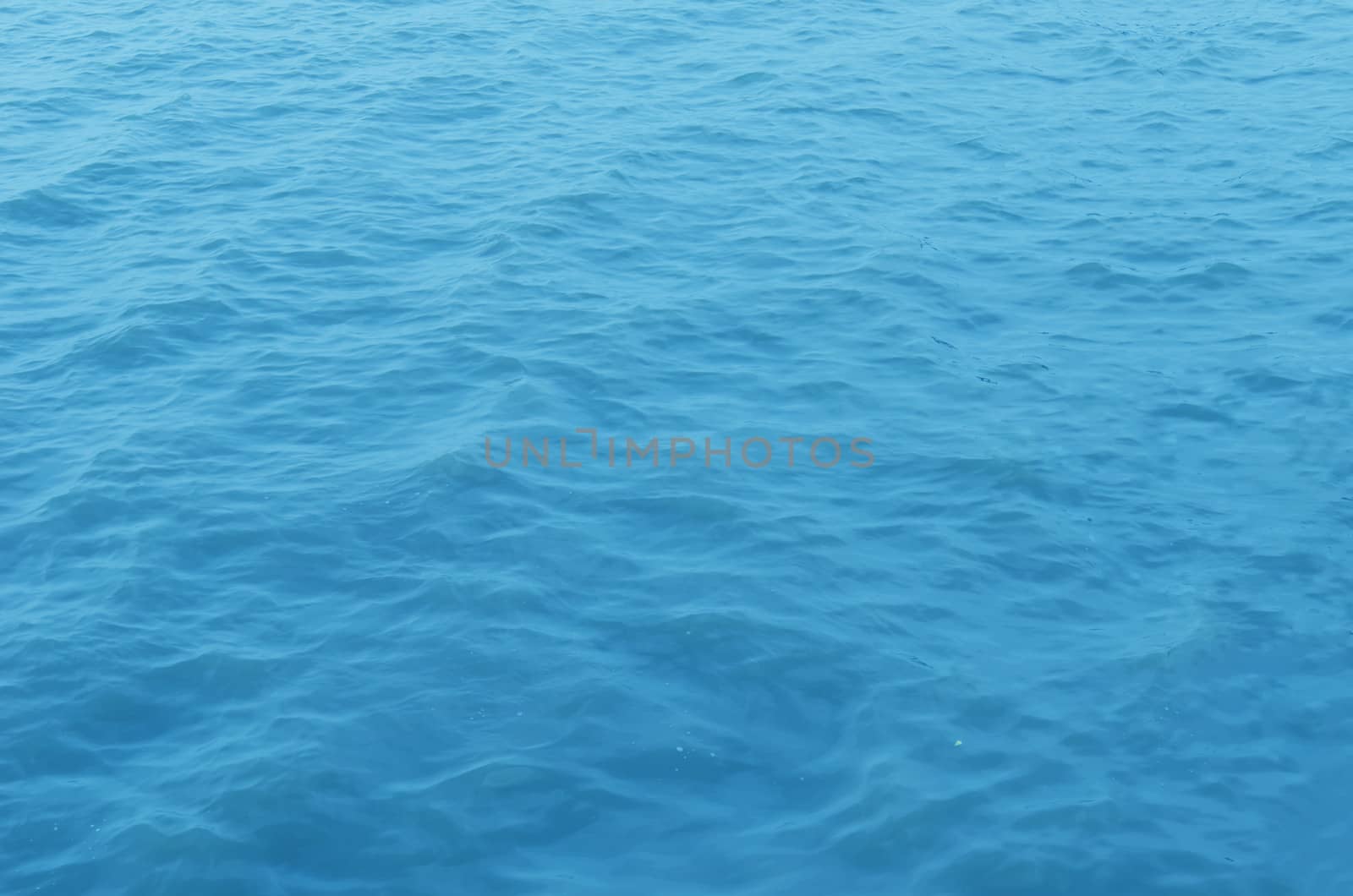 In the open tropical sea , blue water surface
