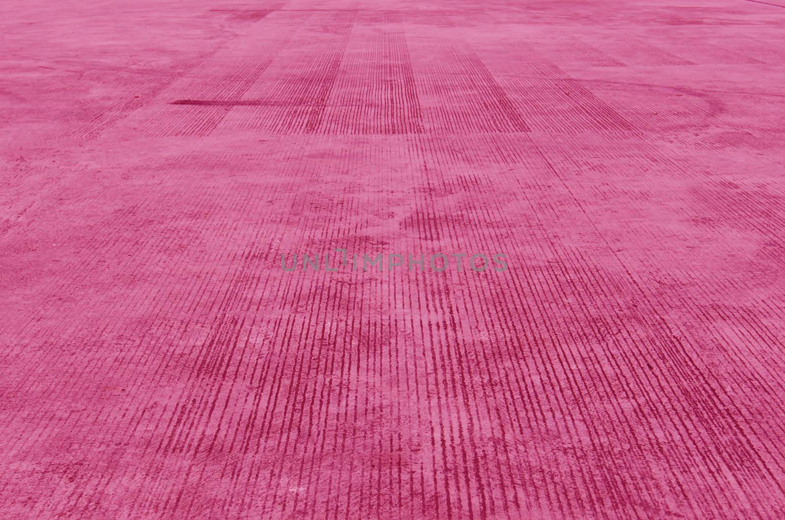 Pink concrete sidewalk stone , ( Textured cement background )