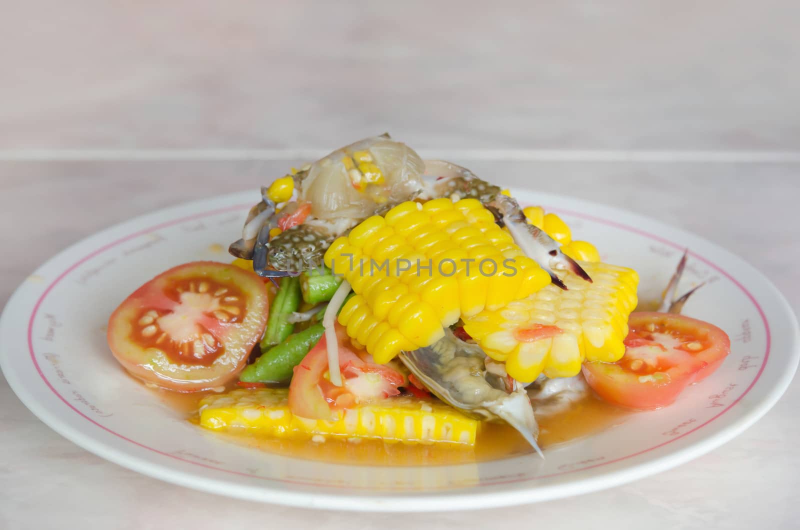 sweet corn  spicy salad with raw crab on dish , asian food