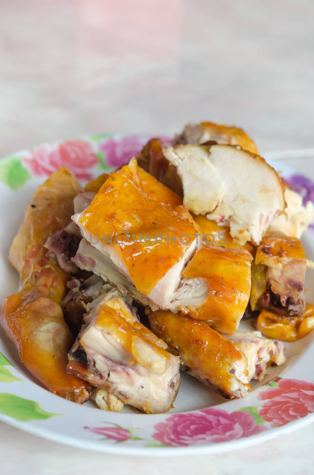 close up asian style grilled chicken on dish , thai meat fast food