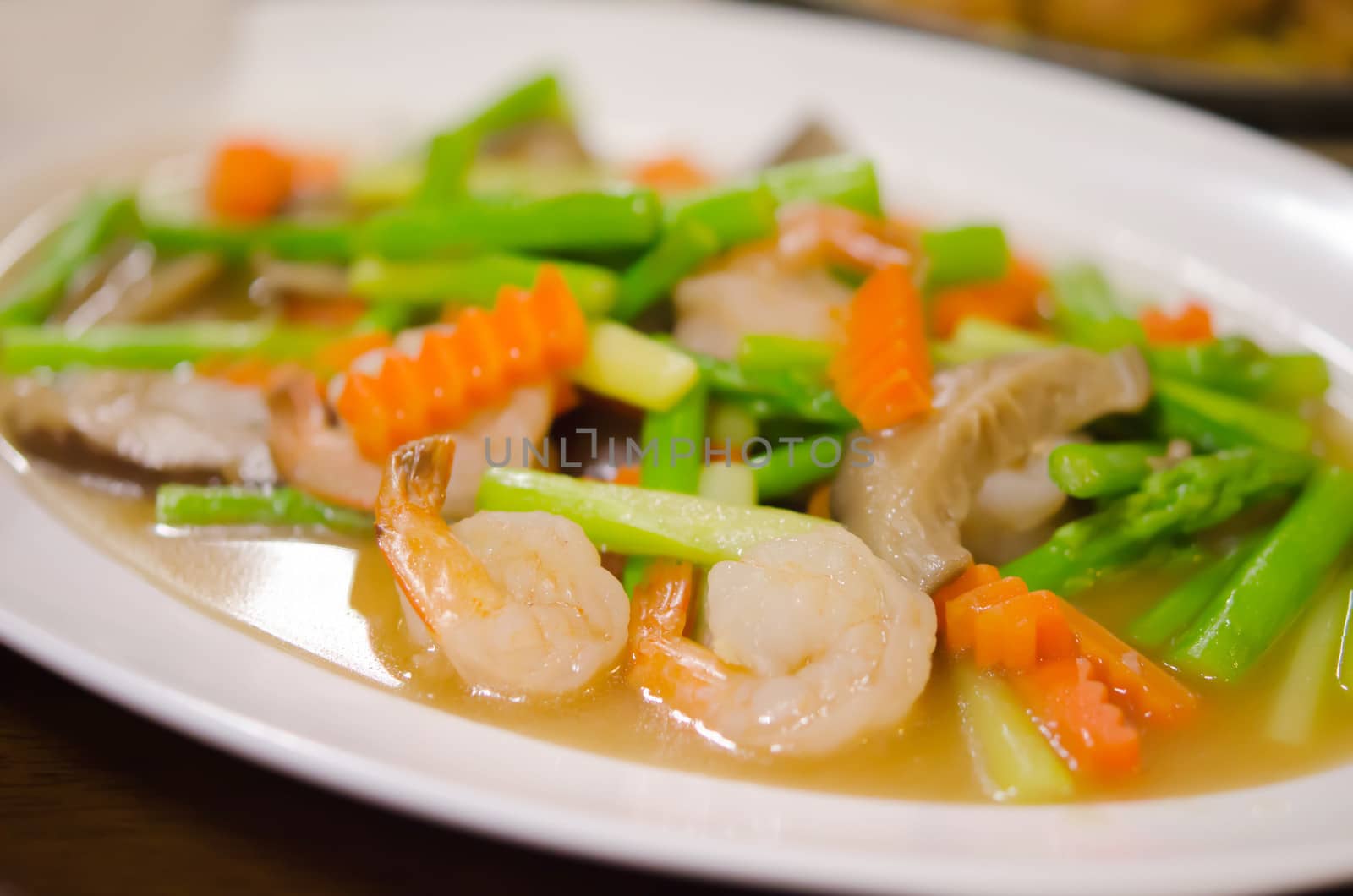 close up  stir fried  prawn  with mix vegetable on dish