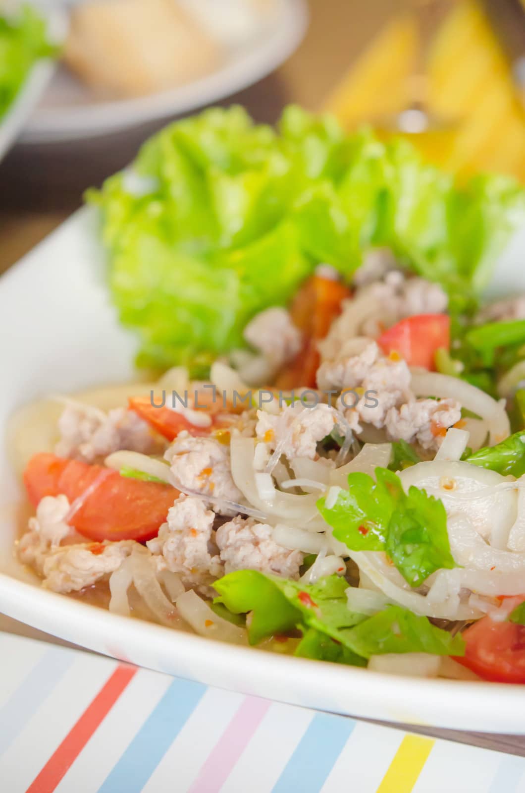close up spicy  salad with  minced pork ,  vermicelli , chili and fresh vegetable 