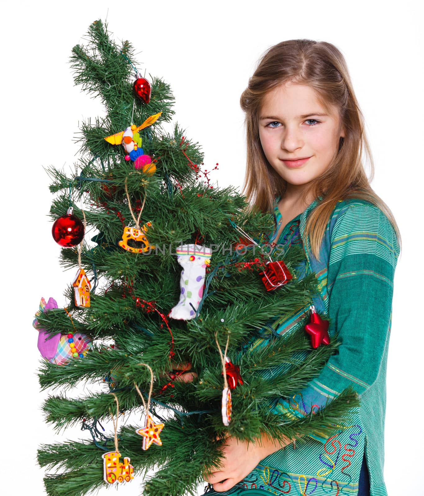 Christmas theme - Beautiful girl decorating christmas tree. Isolated on white backround.