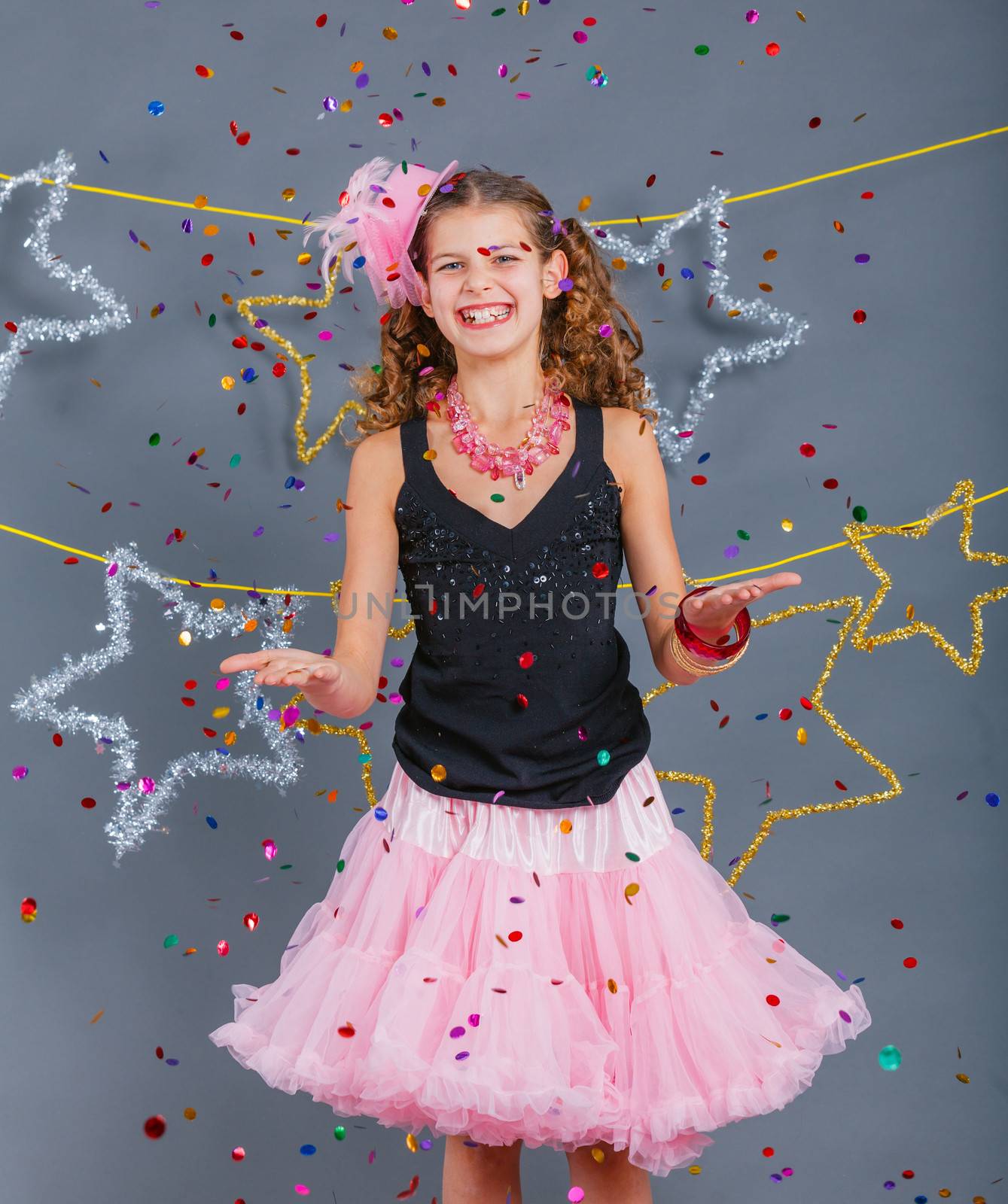 Fashion girl is wearing masquerade costume. Holiday theme/Emotion child.