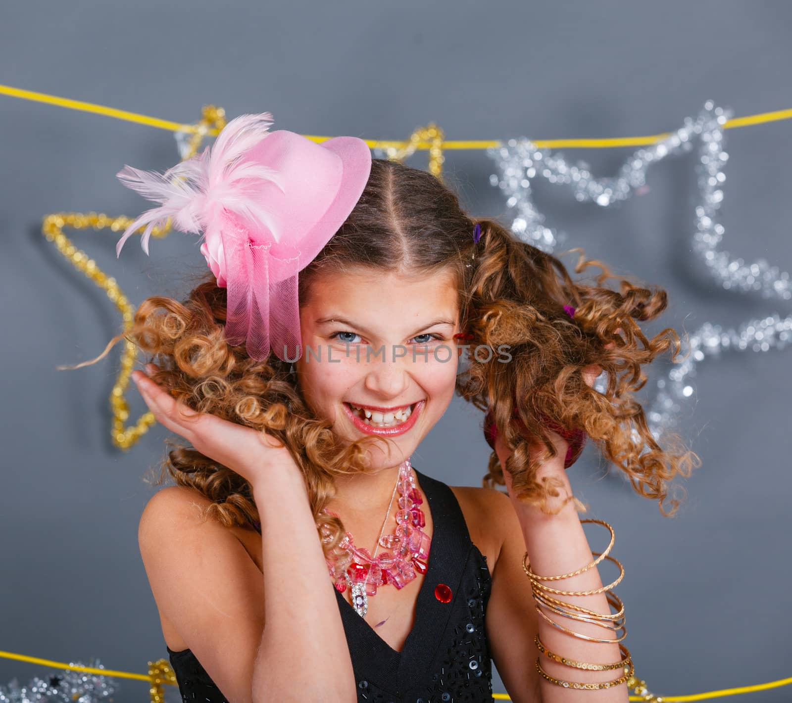 Fashion girl is wearing masquerade costume. Holiday theme/Emotion child.