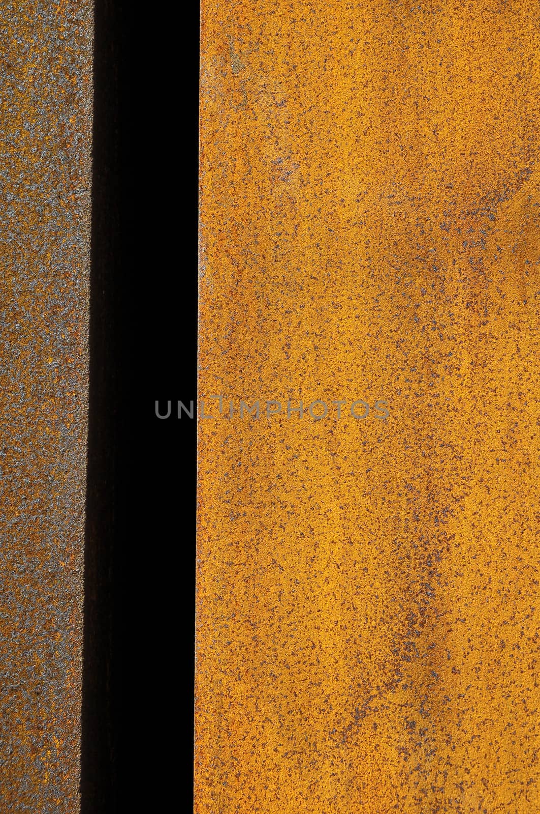 Orange Patterns on the Rusty Surface of the Metal