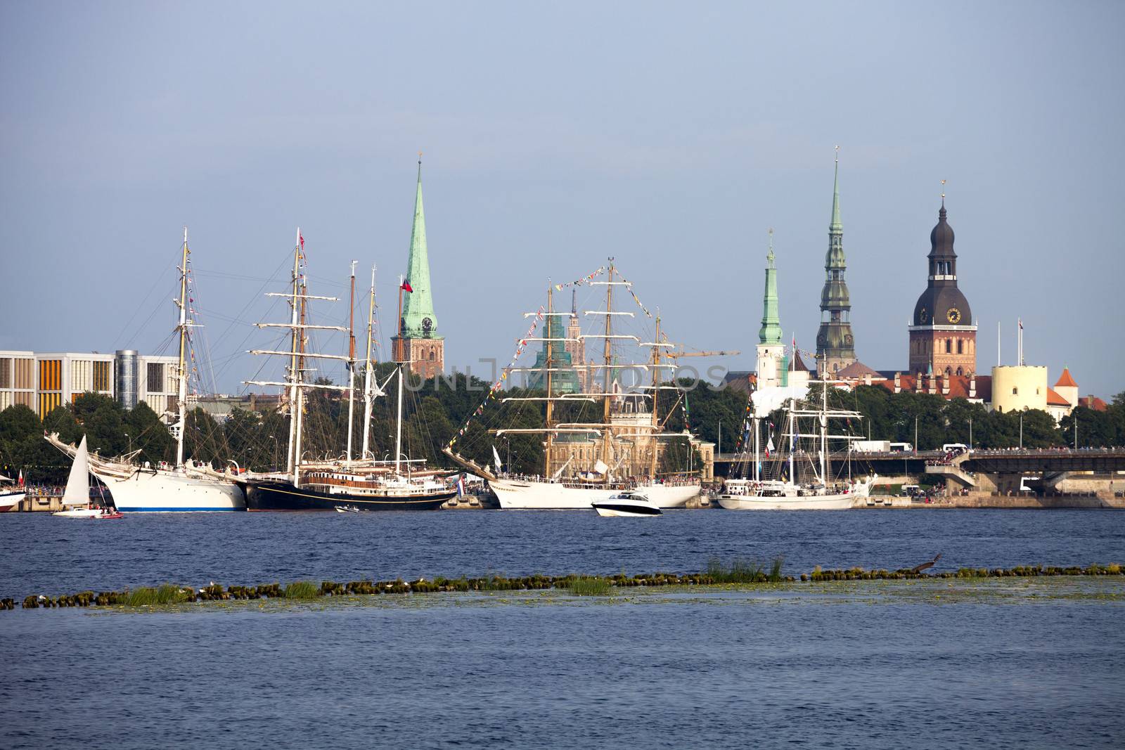 RIGA, LATVIA - JULY 26: The tall ships races ships in port with traditional Riga skyline in background July 26, 2013 Riga, Latvia.