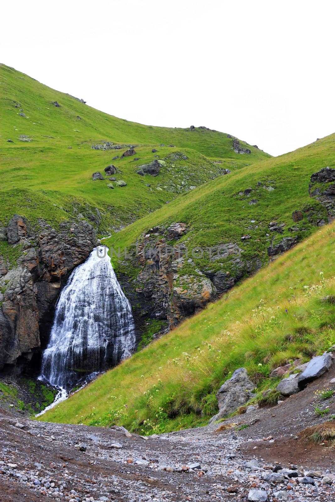 Waterfall Girlish Braids between the mountains of Northern Caucas