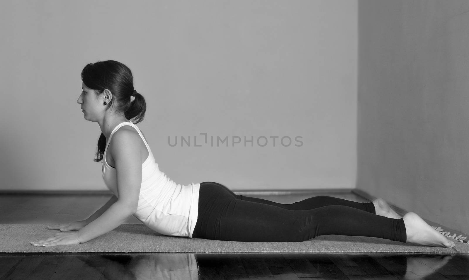 Girl doing Bhujangasana yoga pose