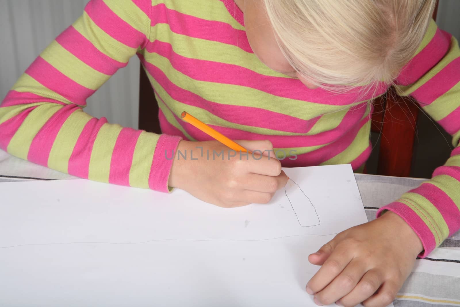 young child writting , painting and playing with colours (chinese child)
