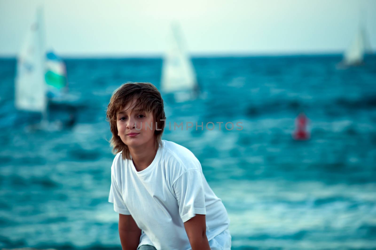 Portrait of a boy on the docks at the yacht club in Tel Aviv.