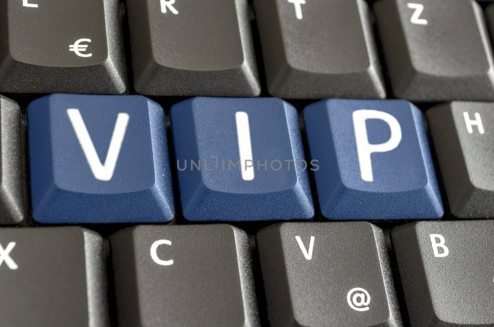 Abbreviation VIP written with blue keys on computer keyboard.