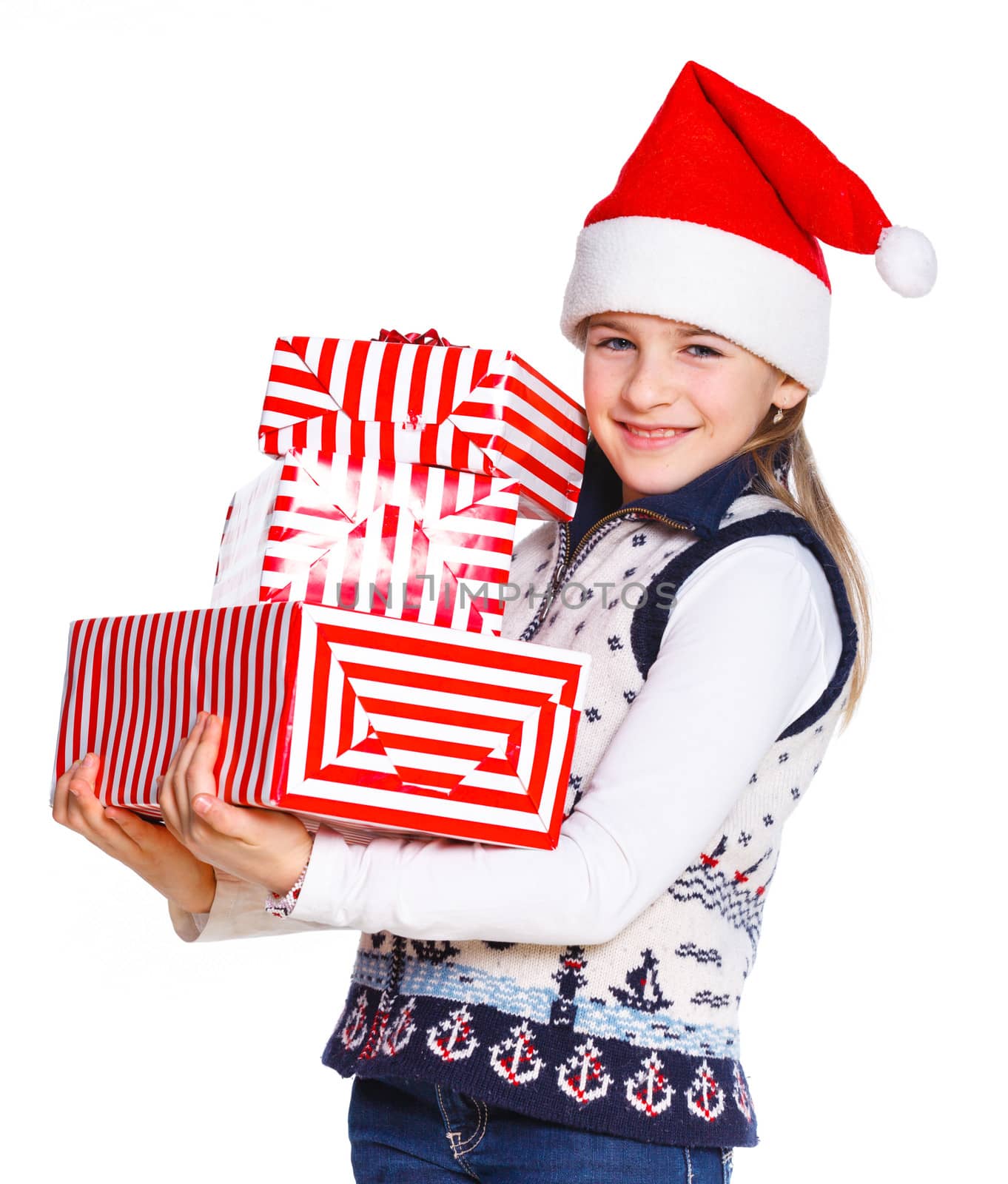Christmas theme - Smiling cute girl in Santa's hat with gift box, isolated on white