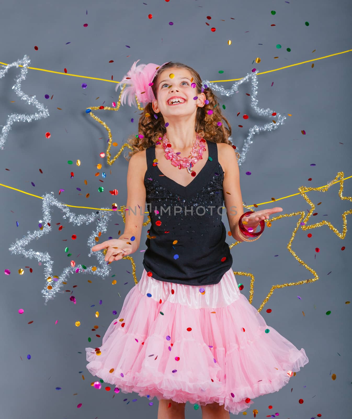 Fashion girl is wearing masquerade costume. Holiday theme/Emotion child.